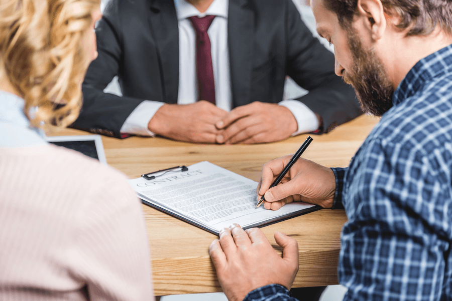 An agreement being signed across a table